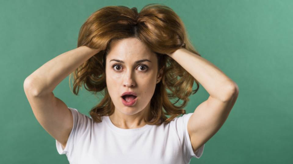 surprised-young-woman-with-her-two-hands-hair-against-green-backdrop_23-2148056324 (1)